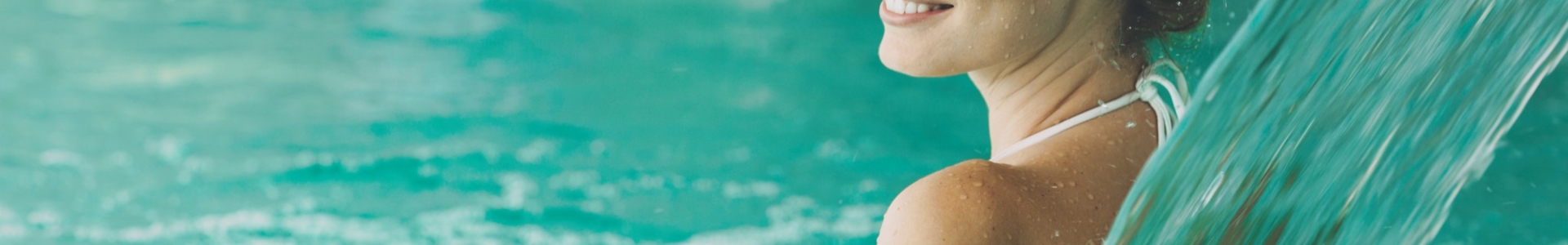wellness_spa_bath_relax_adventure_pool_smiling_brunette_sh_512568115