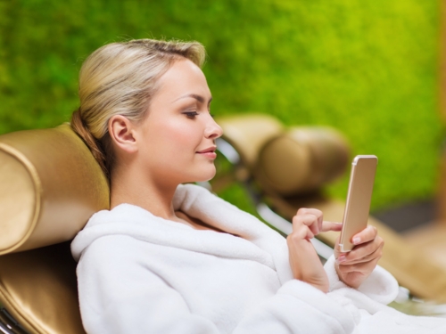 wellness_weekend_relaxing_bathrobe_blonde_woman_phone_texting_online_shopping_sh_241812979